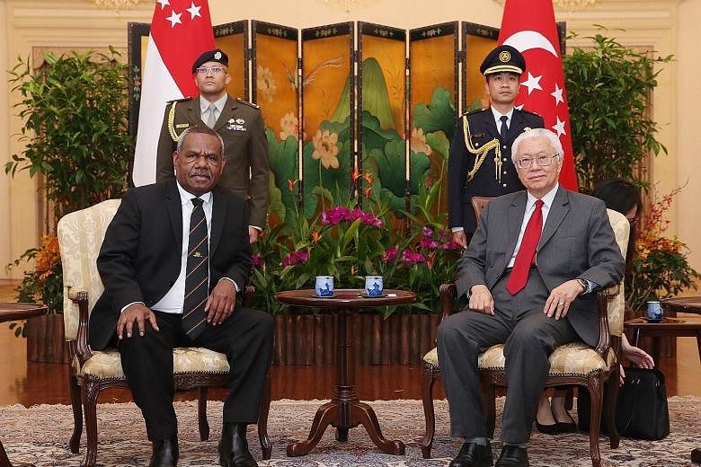 Governor-General of Papua New Guinea Bob Dadae paying a courtesy call to President Tony Tan Keng Yam at the Istana yesterday afternoon. In a Facebook post, Dr Tan noted that Singapore shares "warm and friendly relations" with Papua New Guinea, adding