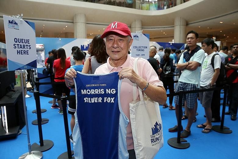 Mr Morris Ng, who was first in line to collect his ST Run race pack at Suntec City yesterday, customised his race vest for $15.