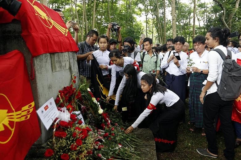Representatives from the All Burma Federation of Student Unions at a service (left) held every year in memory of those killed during a crackdown on a student protest at the university (above) on July 7, 1962. Myanmar citizens living in Thailand prote