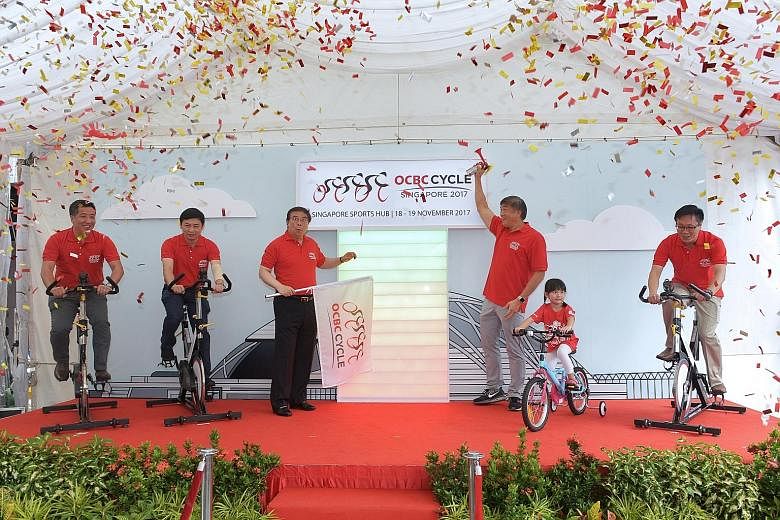 (From left) Straits Times news editor Marc Lim, Singapore Cycling Foundation president Jeffrey Goh, OCBC group CEO Samuel Tsien, Sport Singapore CEO Lim Teck Yin, young cyclist Ariel Ow Yong and Business Times editor Wong Wei Kong at the launch of OC
