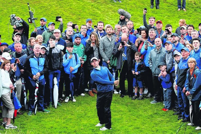 The passionate Portstewart crowd watching Rory McIlroy play out of the rough in the second round. He needs to improve quickly for the Open.