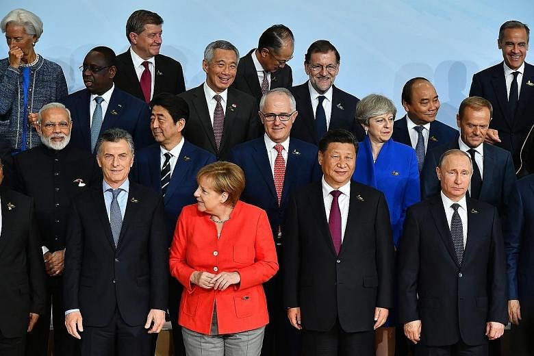 Prime Minister Lee Hsien Loong with G-20 leaders, including Indian Prime Minister Narendra Modi, Japanese Prime Minister Shinzo Abe, Australian Prime Minister Malcolm Turnbull, British Prime Minister Theresa May, German Chancellor Angela Merkel, Chin