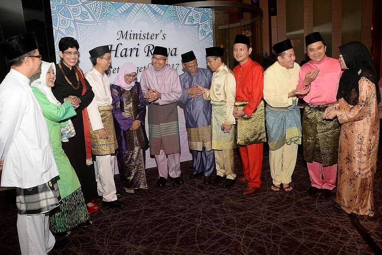 Minister-in-charge of Muslim Affairs Yaacob Ibrahim (centre) with (from far left) MPs Zainal Sapari, Rahayu Mahzam and Fatimah Lateef; Senior Parliamentary Secretary for Education and Social and Family Development Faishal Ibrahim; Speaker of Parliame