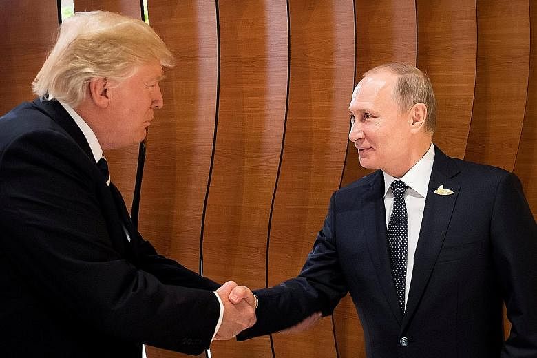 US President Donald Trump meeting Russian President Vladimir Putin during the G-20 summit in Hamburg, Germany, yesterday. Mr Trump said as the meeting began that the two leaders "look forward to a lot of positive things happening, for Russia, for the
