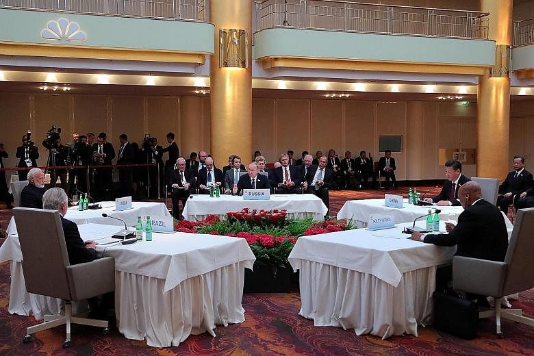 Clockwise, from foreground left: Brazilian President Michel Temer, Indian Prime Minister Narendra Modi, Russian President Vladimir Putin, Chinese President Xi Jinping and South African President Jacob Zuma at a Brics leaders' meeting on the sidelines
