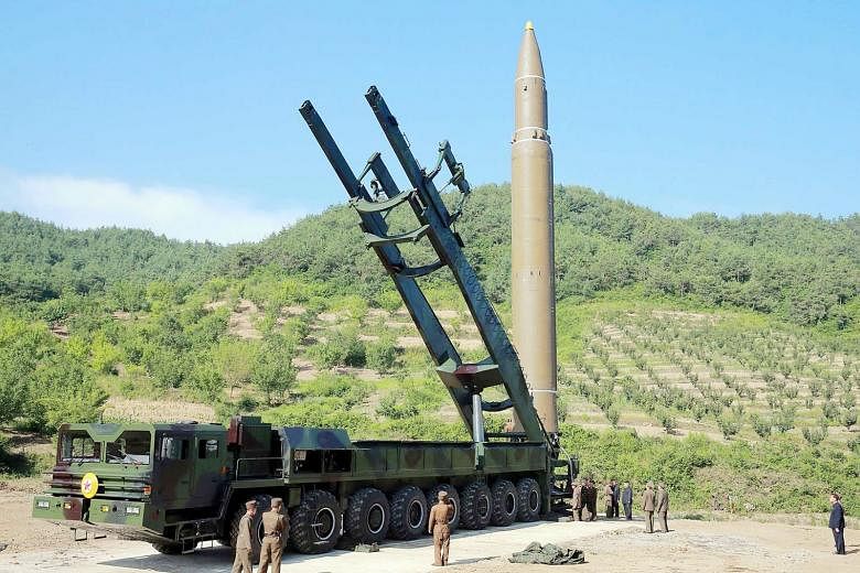 A photo released by North Korea's official Korean Central News Agency shows the North's ICBM which was launched on Tuesday. North Korea needs a missile with a range of 8,000 to 12,000km to hit the lower 48 states in the continental US.