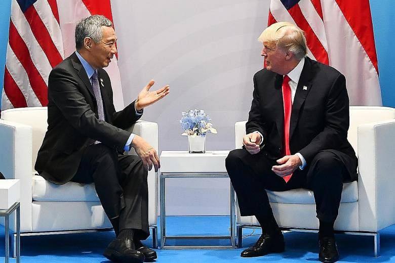 Prime Minister Lee Hsien Loong meeting US President Donald Trump in Hamburg yesterday. They reaffirmed the two sides' excellent bilateral ties and committed to work together to advance relations.