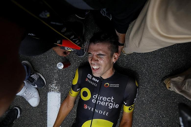 Direct Energie rider Lilian Calmejane succumbs to his exertions after winning the eighth stage of the Tour de France. The Frenchman almost came to a halt 5km from the line.