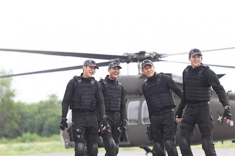 Cast members on the set of Thai drama Love Missions. The series follows four leading men as they pursue drug traffickers, terrorists - and love interests. The name of the first instalment, Pull The Trigger On My Heart, became a trending hashtag on Tw