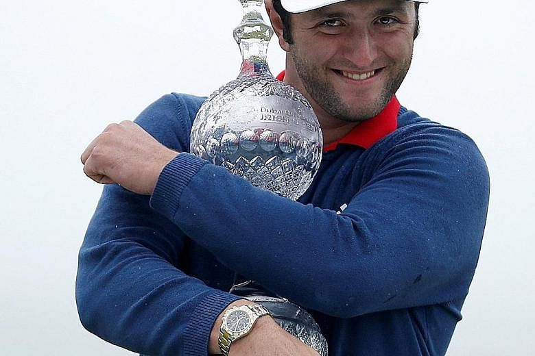 Spanish golfer Jon Rahm with the Irish Open trophy after a final-round 65 at Portstewart in Northern Ireland. His 24-under total broke both the course and tournament record and he aims to emulate his legendary late countryman Seve Ballesteros by winn