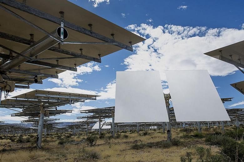 Solar panels at the Ivanpah Solar Electric Generating System in the Mojave Desert. Yieldcos are formed to hold operating wind and solar farms that a parent company had built or acquired. Revenues from those assets fund dividends.