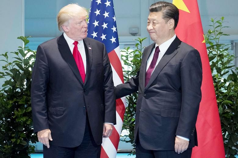 US President Donald Trump and Chinese President Xi Jinping meeting on the sidelines of the G-20 Summit in Hamburg, Germany, on Saturday. Mr Trump's disappointment over his failure to persuade Mr Xi to force Pyongyang to denuclearise the Korean penins