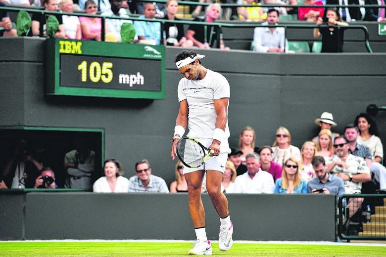 Rafael Nadal showing his frustration after losing a point to Luxembourg's Gilles Muller during their fourth round match at Wimbledon.