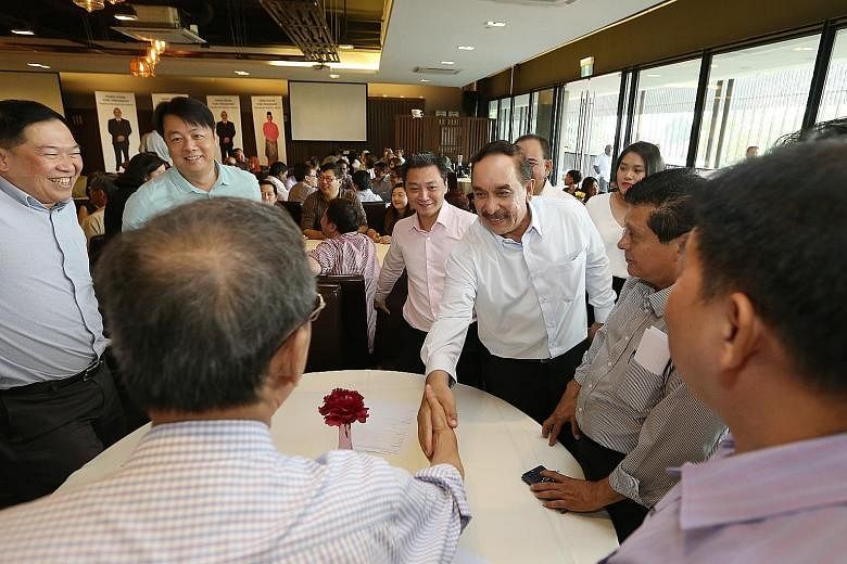 Mr Farid Khan Kaim Khan greeting supporters at the Civil Service Club in Changi yesterday.