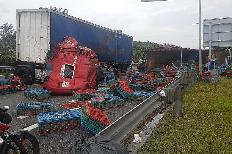 An accident between two trailer trucks on the Second Link Expressway in Johor injured three people and blocked two of three Malaysia-bound lanes yesterday afternoon. The trucks collided just before the Malaysian Customs and immigration complex, causi