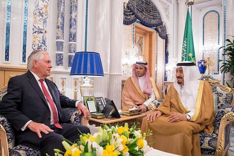 Mr Rex Tillerson meeting Saudi King Salman (far right) in Jeddah yesterday.