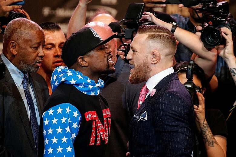 Boxing great Floyd Mayweather and mixed martial arts champion Conor McGregor squaring off at Staples Centre in Los Angeles ahead of their Aug 26 boxing bout in Las Vegas.