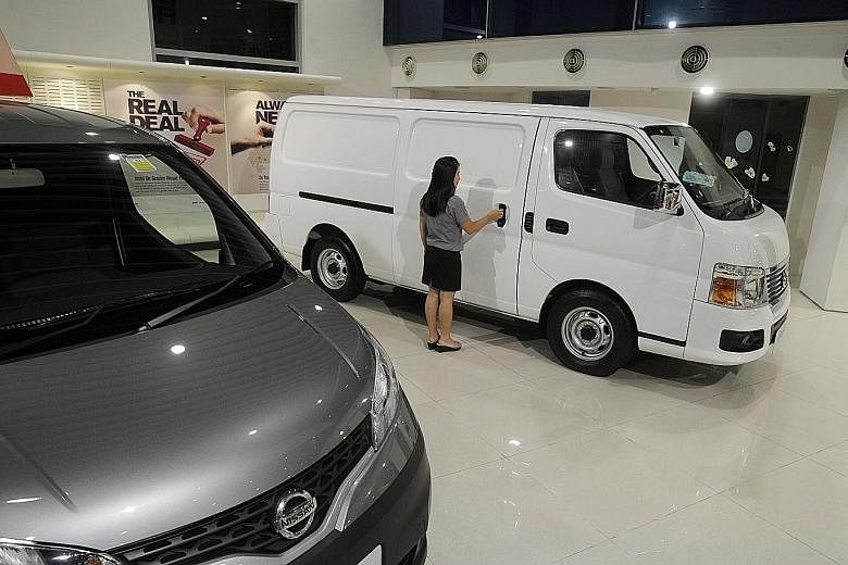 Nissan commercial vehicles on display at Tan Chong Motors' showroom. Mr Ron Lim, general manager of the Nissan agent, said the sharp decrease in the commercial vehicle COE supply was a result of far fewer fleet owners scrapping their older vans, truc
