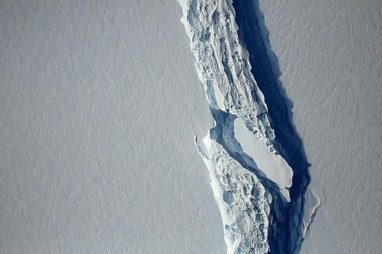 The ice rift in the Larsen C Ice Shelf in Antarctica last month (above) and the rift in November last year (left). A trillion-tonne iceberg snapped off the ice shelf sometime between Monday and yesterday.
