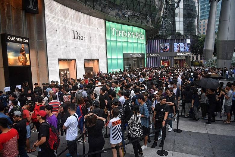 Excited fans queue overnight outside Ion Orchard for Louis Vuitton and  Supreme collaboration