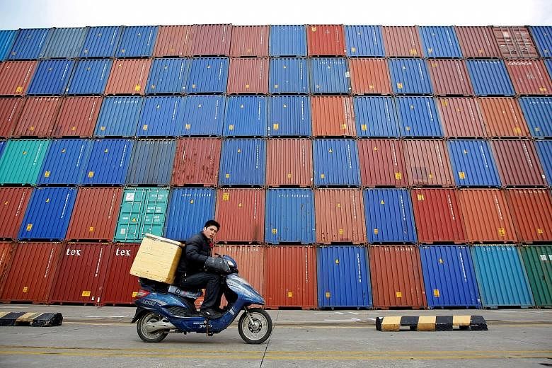 Shipping containers in Shanghai. In Asia, the outlook remains dovish. For instance, the Bank of Japan is not expected to significantly change its massive bond buying programme anytime soon, and China's authorities remain in supportive mode, even as t