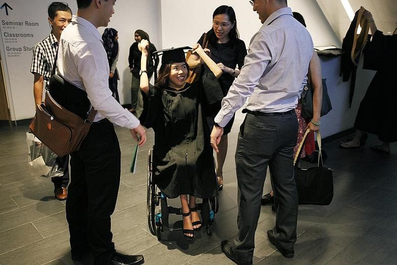 Yip Pin Xiu adjusting her mortar board before her commencement ceremony at SMU, having deferred her studies for a year to focus on training for the Rio Games. The three-time Paralympic champion will next compete in the Asean Para Games and World Cham