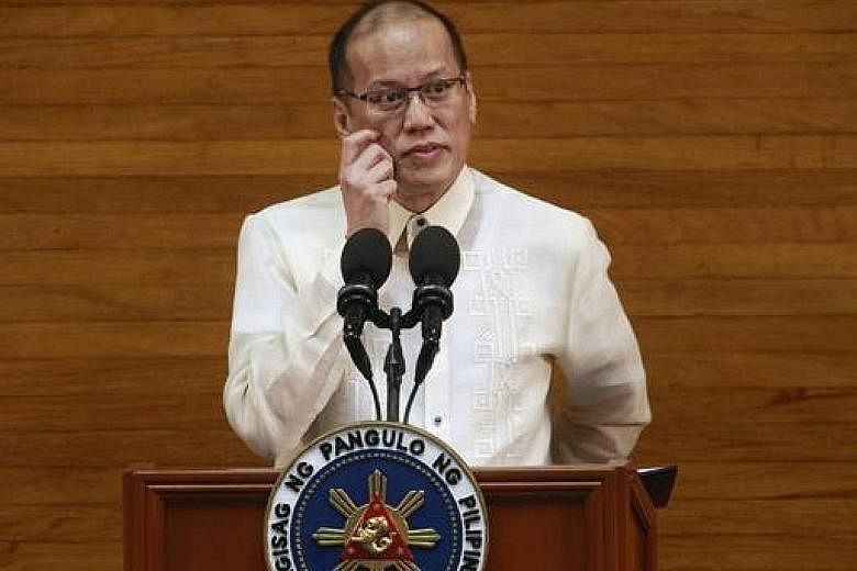 Former Philippine president Benigno Aquino, seen in a 2015 photo, has been indicted for graft and "usurpation of authority" in connection with a raid on the lair of Malaysian terrorist Zulkifli Hir in 2015.