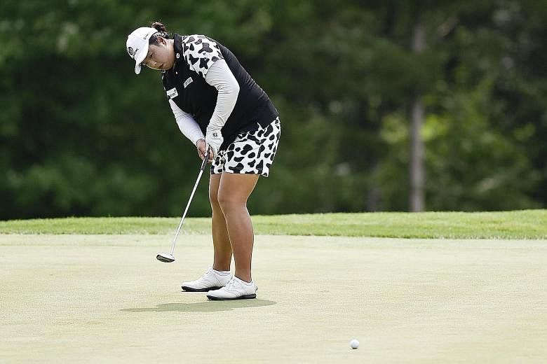 Feng Shanshan putting on the fifth hole in the first round of the US Women's Open at Trump National Golf Club in New Jersey. She enjoyed a great start with three birdies in her first four holes and played comfortably after that for a 66, to lead Amy 