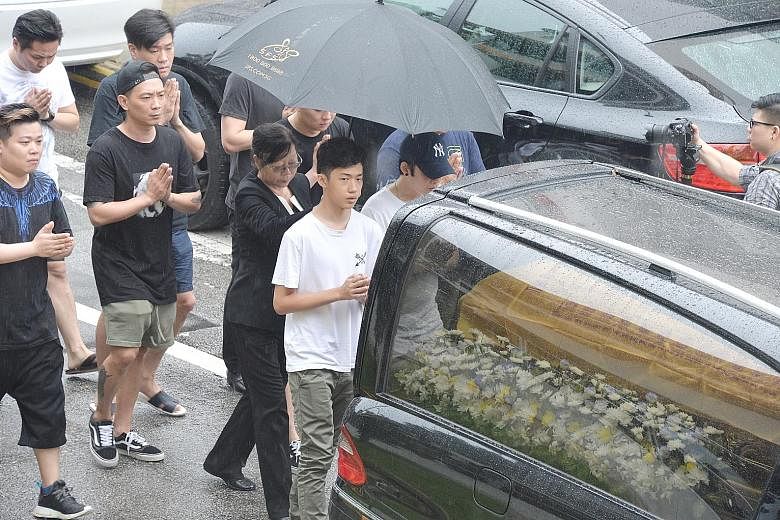 The funeral cortege for Mr Spencer Tuppani, who was cremated yesterday. His father-in-law, Tan Nam Seng, is accused of murdering him.