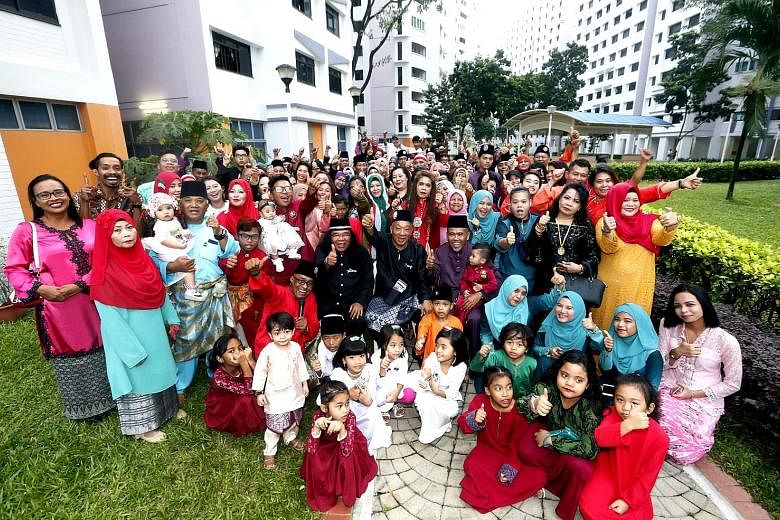 The guests at the reunion dinner yesterday which saw many of the former neighbours from Kampung Jalan Ara meeting for the first time after they moved out of their old homes in 1987. Three members of the committee that organised the event are seated i