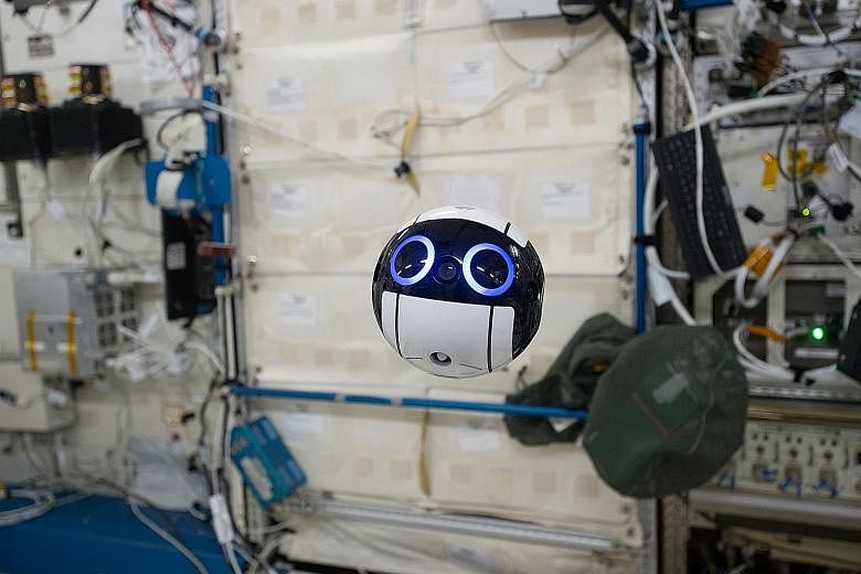 A handout photo issued yesterday showing the JEM Internal Ball Camera or "Int-Ball" taking a video on the International Space Station (ISS) last month. The Int-Ball was delivered to the Japanese Experiment Module, nicknamed Kibo, on the ISS on June 4