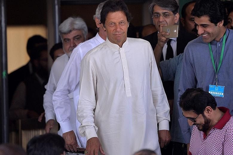 Opposition leader Imran Khan (above) leaving the Supreme Court in Islamabad in May after attending a hearing on the so-called Panama Papers case involving allegations of corruption against Prime Minister Nawaz Sharif (left).