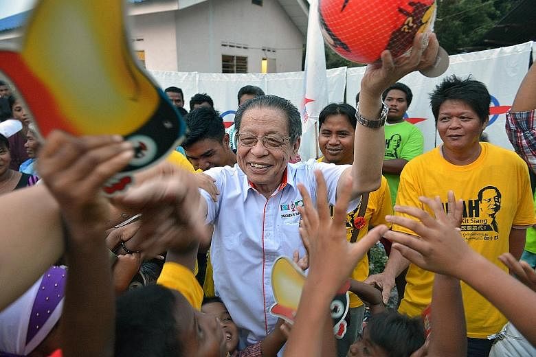 DAP stalwart Lim Kit Siang giving out party souvenirs in Gelang Patah, Johor in 2013. That year, the opposition party stormed to a record 38 parliamentary seats and was unbeaten in its Penang stronghold. It is now the second largest party in Parliame