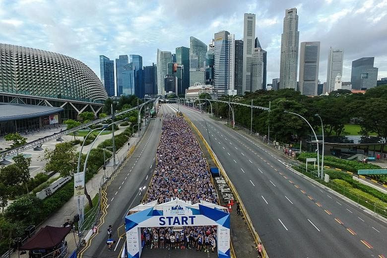 Runners of the 5km race on Esplanade Drive yesterday. This year, the ST Run culminated at the Padang, where a post-race carnival was held.