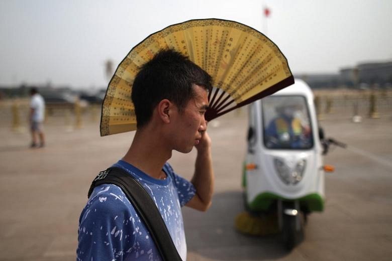 High temperatures drive China residents to seek cool respite below ...