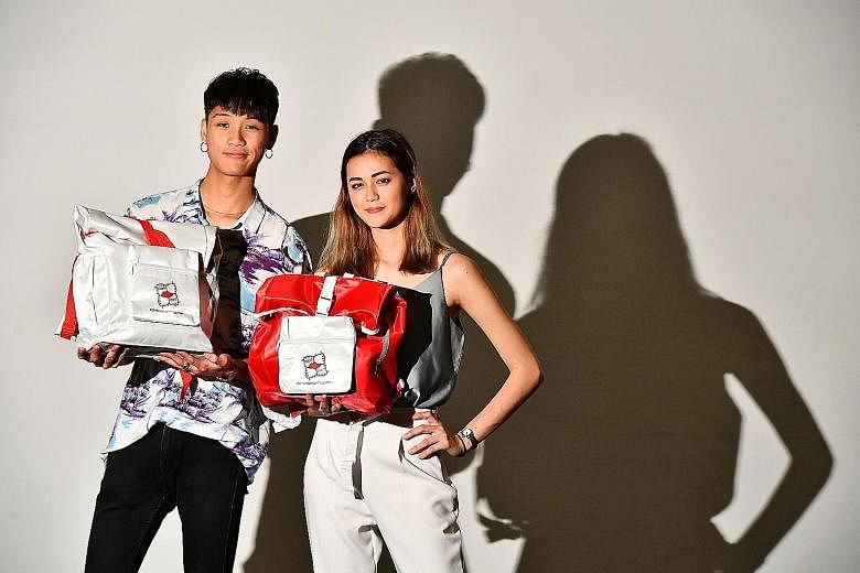 Left: Lasalle College of the Arts graduate Riche Tay and coursemate Denise Richter spent about a month designing the funpacks. Above: Some of the items inside include a mini Singapore flag, which doubles as a flashing LED light, and a handy paper ban