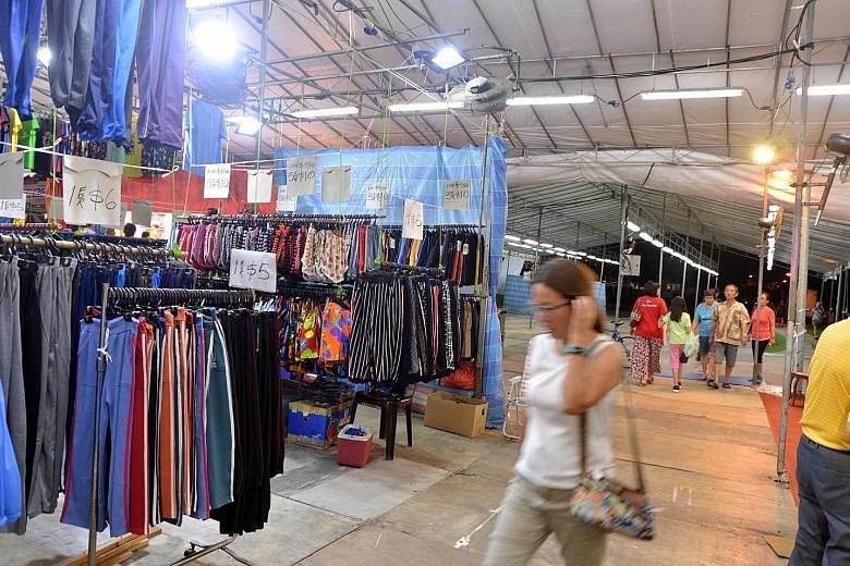 Sungei Road vendors unable to trade since the flea market closed a week ago have been asked to consider a temporary location at a pasar malam (above) beside Sembawang MRT station that opened on Sunday and will run for two weeks.