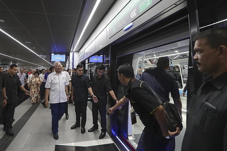Malaysian Prime Minister Najib Razak arriving for a ride after the opening of the second phase of the Greater Kuala Lumpur MRT line yesterday.