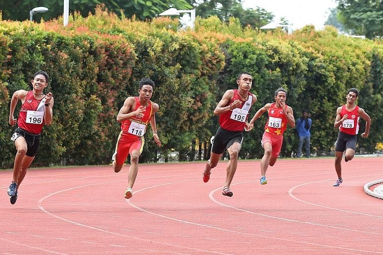 Top: Thailand continue to dominate the sprint events with Siripol Punpa (No. 195), winning the boys' 200m. Above: Girls' 200m champion Kedmanee Janyamitri is a repeat medallist, having clinched bronze at last year's Asean Schools Games.