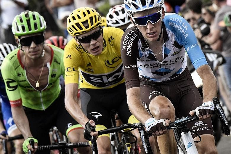 From left: Rigoberto Uran, Chris Froome and Romain Bardet wheel to wheel in the 15th stage of the Tour de France on Sunday.