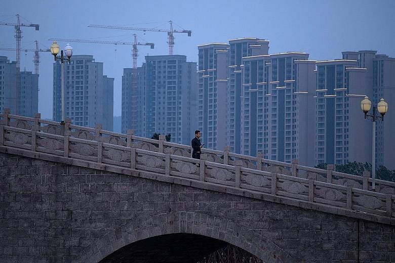 Apartment blocks in Shandong province. While growth in China's high-flying property sector has cooled this year, a rebound in exports has helped prevent a broader slowdown in the country's economy.