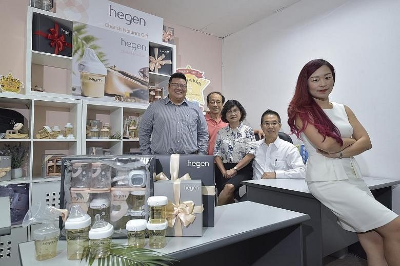 Hegen founder and managing director Yvon Bock (right), 38, with (from left) Hegen managing director Leon Bock, 41; Hegen director B. C. Kow, 71; her mother, Madam Shirley Chai, 64, director of plastics contract manufacturer Fitson Singapore; and her 