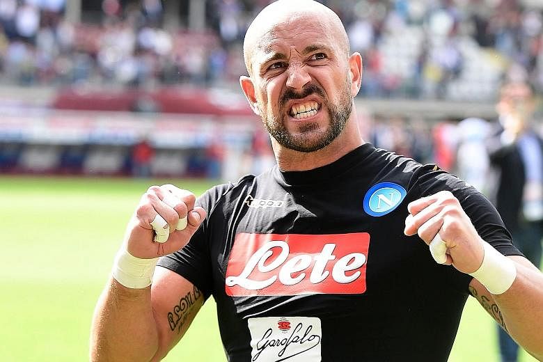 Napoli 'keeper Pepe Reina celebrating with fans after the 5-0 thrashing of Torino in their Serie A game in Turin in May. If the Spaniard returns to England he will feel right at home with City.