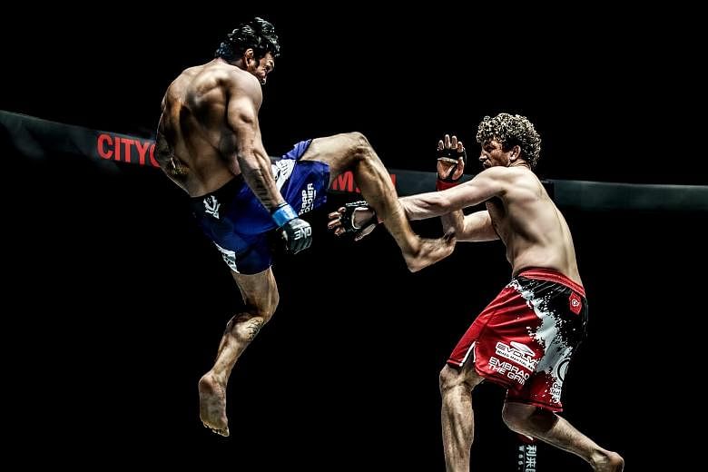 Mr Chatri Sityodtong, One Championship chairman and CEO, called the Sequoia and Mission deals the biggest moment in the MMA firm's history. The extra funds will help it lock down prized fighters like Ben Askren, seen here fending off a kick from Braz