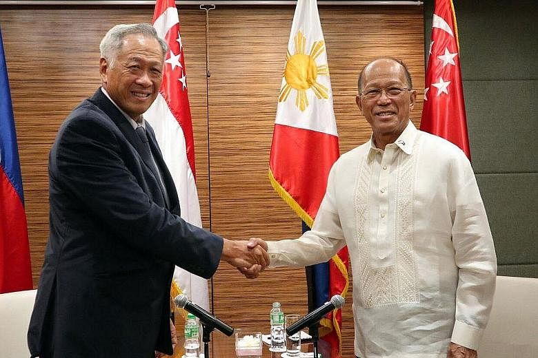 Defence Minister Ng Eng Hen meeting his Philippine counterpart Delfin Lorenzana during his two-day working visit to the Philippines. He said Mr Lorenzana has accepted Singapore's offer of help "in principle".