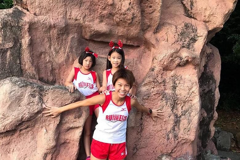 Jasmine Goh with her two daughters - Faith, eight, and 10-year-old Cherish (left). She does not expect her daughters to run competitively but hopes that, through the sport, they take away values such as hard work.