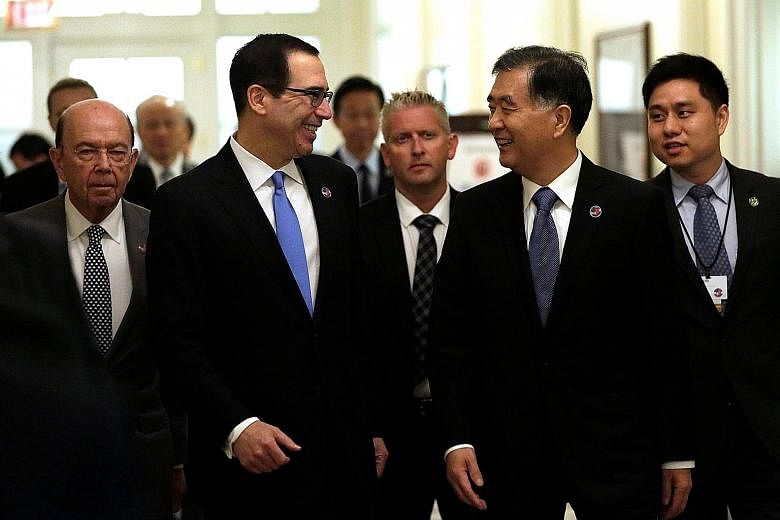 (From left) US Commerce Secretary Wilbur Ross, Treasury Secretary Steven Mnuchin and Chinese Vice-Premier Wang Yang arriving for the US-China economic dialogue in Washington yesterday.