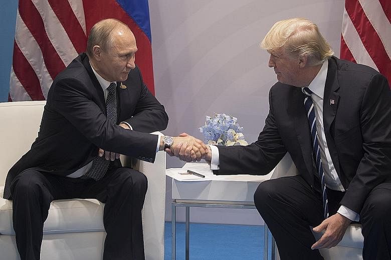 Russian President Vladimir Putin and US President Donald Trump meeting during the G-20 summit in Hamburg, Germany, on July 7. Later that day, the two leaders had a second, previously undisclosed meeting, one in which there is no official US governmen