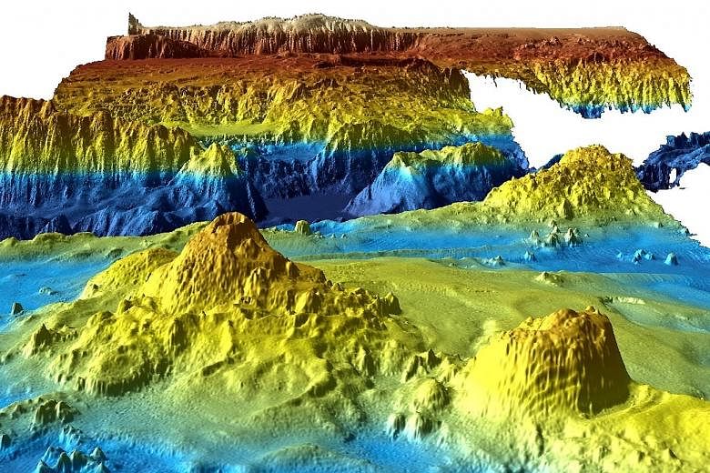 A computer-generated view (left) of part of the area (above) searched during the hunt for MH370. The data reveals an underwater world of soaring ridges, deep valleys and volcanoes.