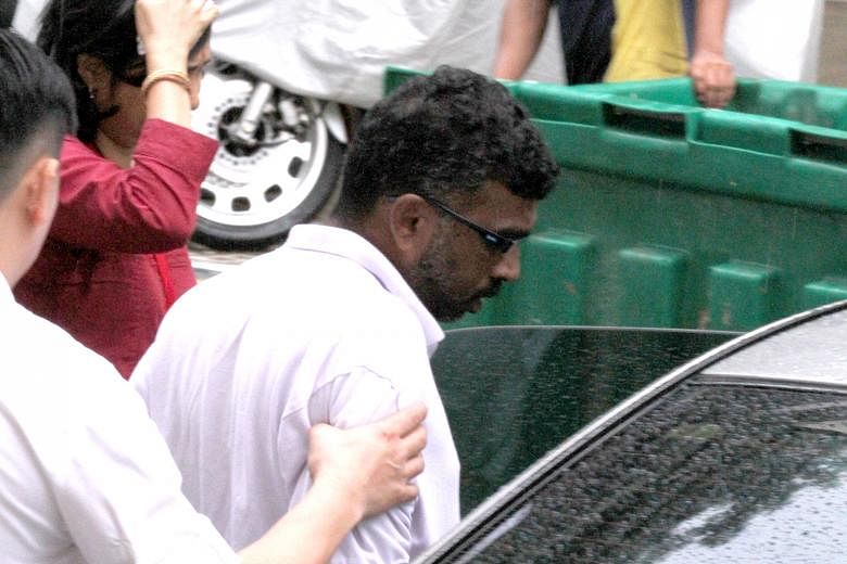 P. Mageswaran being escorted to the scene of the crime by police on Dec 23, 2013. He was spared life imprisonment as his case did not fall within the worst type of culpable homicide cases that deserved the maximum sentence.